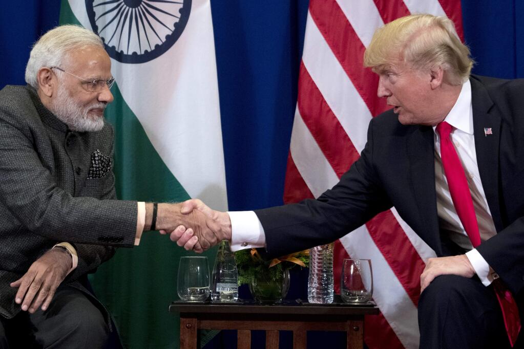 President Donald Trump, right, and Indian Prime Minister Narendra Modi shake hands during a bilateral meeting at the ASEAN Summit at the Sofitel Philippine Plaza, Monday, Nov. 13, 2017, in Manila, Philippines. Trump is on a five country trip through Asia traveling to Japan, South Korea, China, Vietnam and the Philippines. (AP Photo/Andrew Harnik)