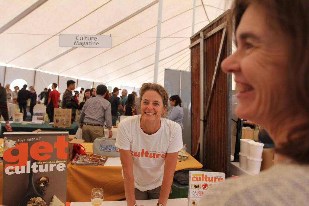 Co owner of Culture Magazine, Lassa Skinner shares laughs with guests at California's 9th annual Artisan Cheese festival during the Artisan Cheese Tasting and Marketplace in the Grand Tasting Tent held at The Sheraton of Sonoma County on Sunday March 22, 2015. (Victoria Webb/For The Argus-Courier)