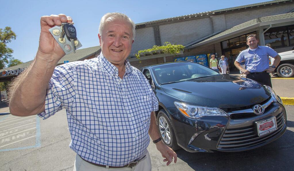 Robbi Pengelly/Index-TribuneCar winnerOn Tuesday, July 26, Sonoma resident Allan Fisher was presented with a 2016 Toyota Camry, which he won by shopping at Lucky supermarket. Shoppers were automatically entered into the contest for every $10 spent on qualifying products. Save Mart sponsored the contest in celebration of its partnership with Sonoma Raceway.