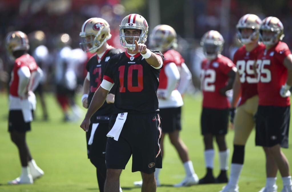 San Francisco 49ers quarterback Jimmy Garoppolo gestures during practice at the team's headquarters Thursday, July 26, 2018, in Santa Clara. (AP Photo/Ben Margot)
