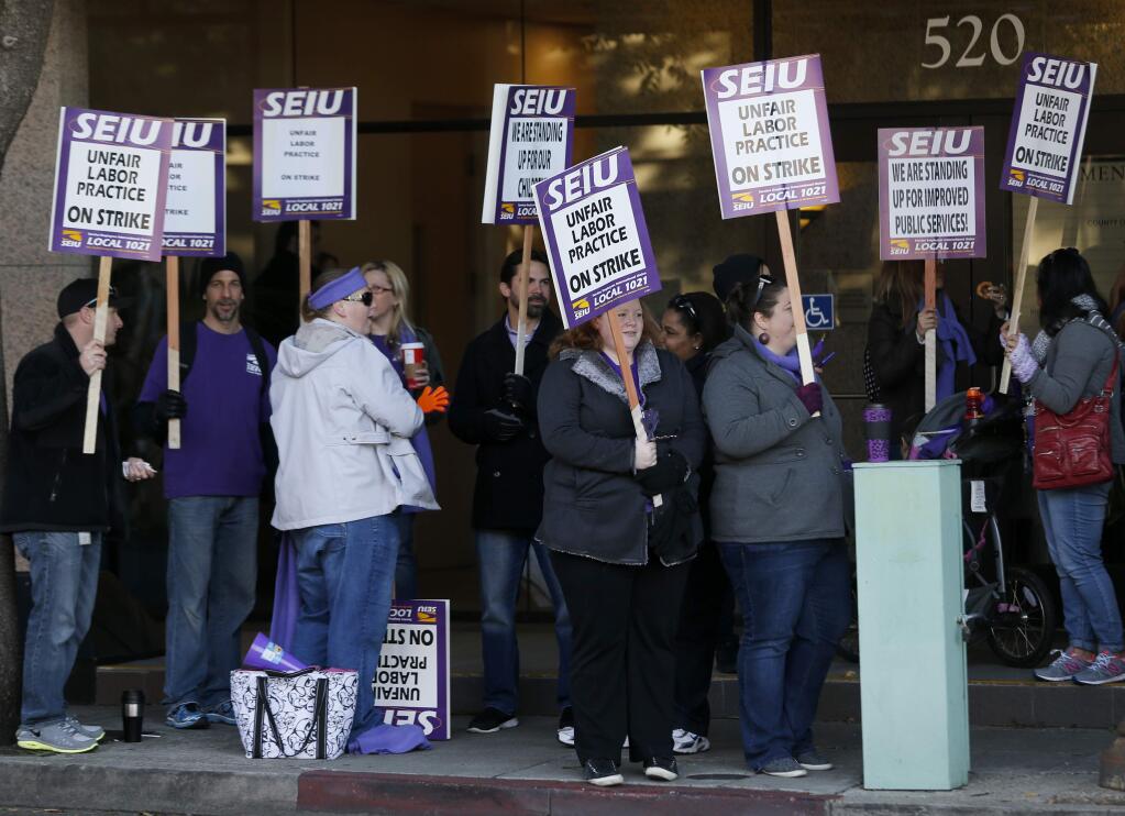 Sonoma County employees are expected to return to work today after a three-day strike. (BETH SCHLANKER / The Pres Democrat)