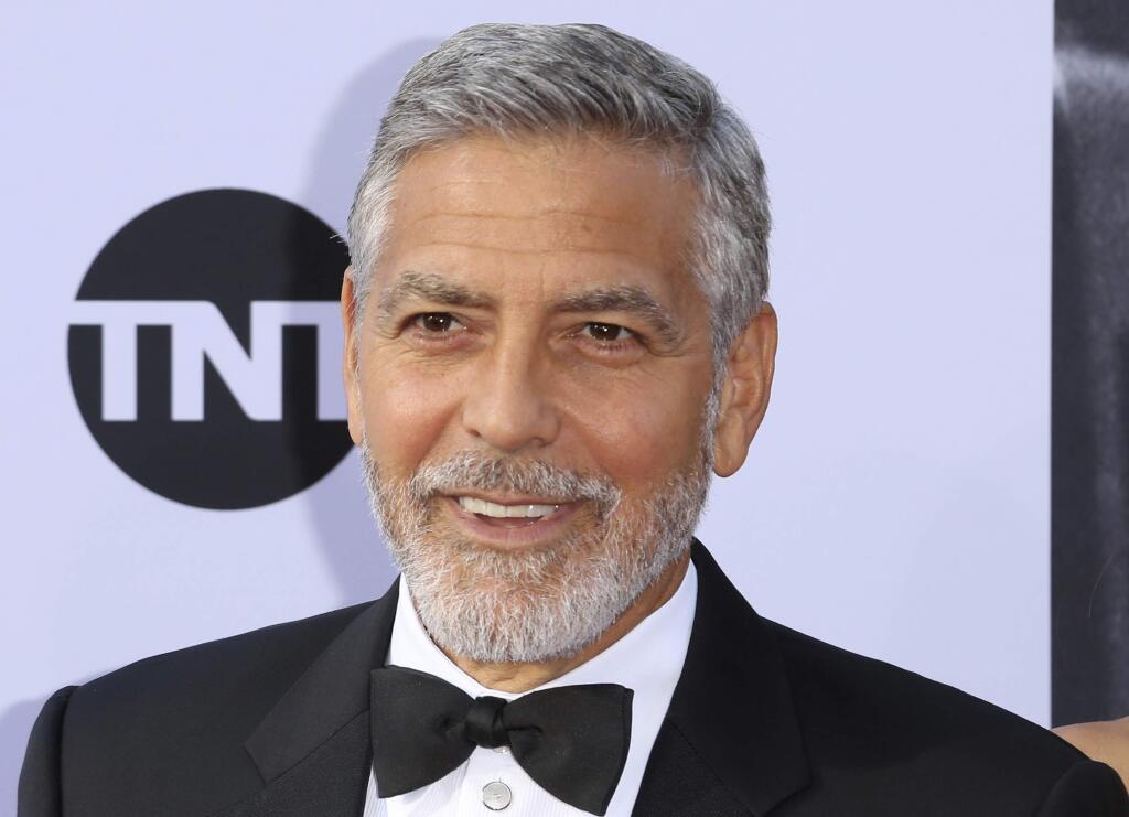 FILE - In this Thursday, June 7, 2018 file photo, George Clooney arrives at the 46th AFI Life Achievement Award Honoring himself at the Dolby Theatre in Los Angeles. Italian media say actor George Clooney has been hospitalized after he was involved in an accident while riding a motorcycle in Sardinia it was reported on Tuesday, July 10, 2018. Local daily La Nuova Sardegna says Clooney's injuries aren't serious, but that he was taken to the John Paul II hospital emergency room. Police said they have no information, and the hospital didn't respond to requests for comment. (Photo by Willy Sanjuan/Invision/AP, File)