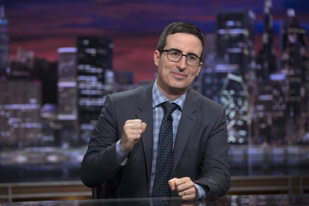 FILE - This file image provided by HBO shows John Oliver on the set of 'Last Week Tonight with John Oliver.' HBO says it has regained control of its social media accounts after the latest security breach to hit the entertainment company. On Wednesday, Aug. 16, 2017, the hacking group OurMine took over several of HBO's Twitter accounts, including for the “Game of Thrones” and John Oliver shows. The group posted that “we are just testing your security” and asked HBO to contact it for an upgrade. (Eric Liebowitz/HBO via AP, File)