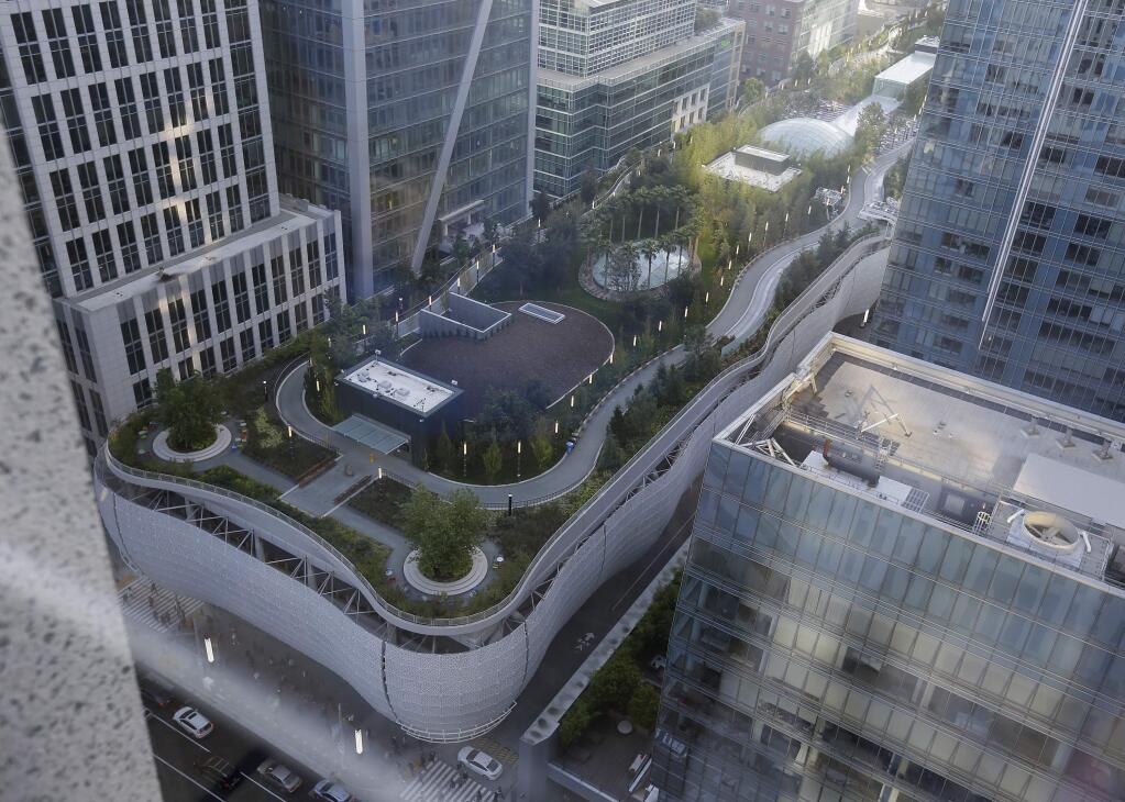 The Salesforce Transit Center complex, stretching several blocks, is seen following its closure Tuesday, Sept. 25, 2018, in San Francisco. San Francisco officials shut down the city's celebrated new $2.2 billion transit terminal Tuesday after discovering a crack in a support beam under the center's public roof garden. Coined the 'Grand Central of the West,' the Salesforce Transit Center opened in August near the heart of downtown after nearly a decade of construction. It was expected to accommodate 100,000 passengers each weekday, and up to 45 million people a year. (AP Photo/Eric Risberg)