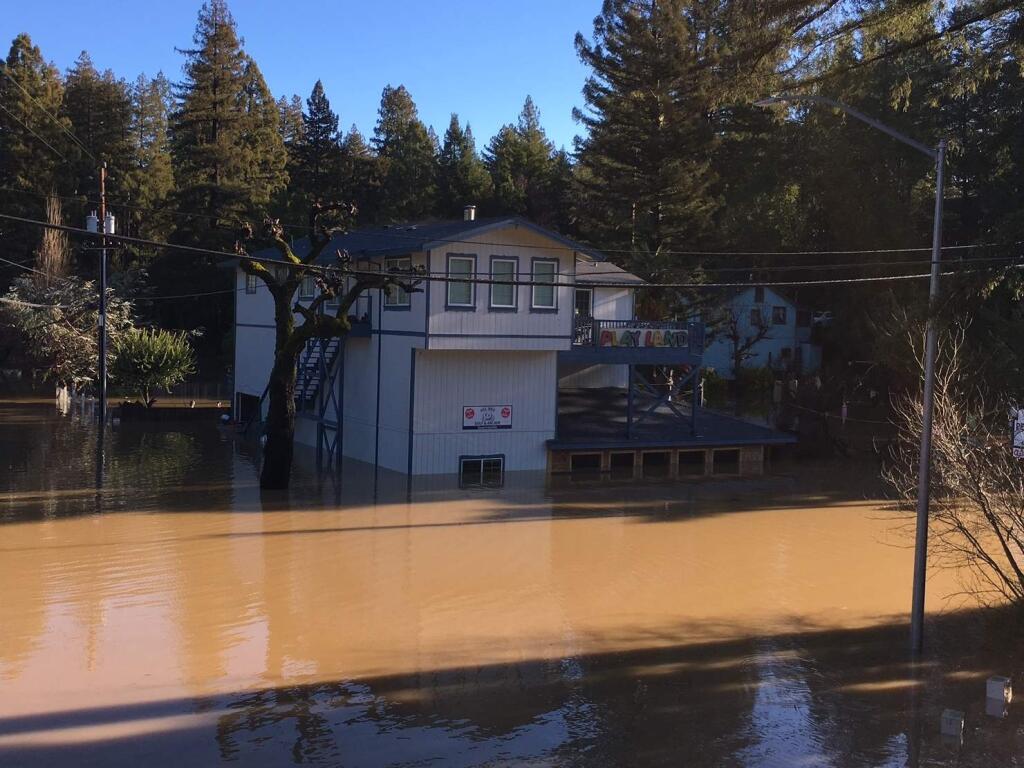 Flood water in Guerneville starts to recede on Mill Street leaving behind mud caked reminders of the level of the Russian River, Thursday, March 28, 2019. (Kent Porter / The Press Democrat) 2019