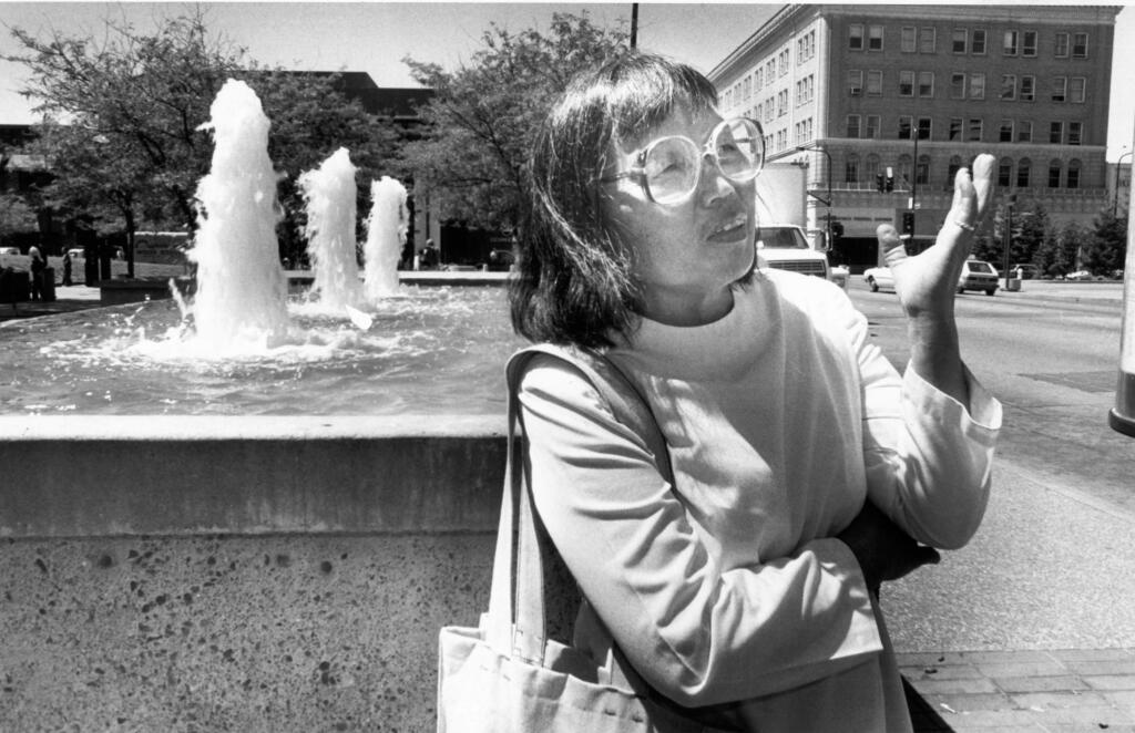 Renowned Japanese American sculptor Ruth Asawa (1926-2013) expresses her ideas to the Development Commission while touring the fountain area in Santa Rosa's Old Courthouse Square in June 1984. She created panels that depicted Sonoma County history and landscape which were installed on the fountain in 1987 and removed in 2016-17. The U.S. Post Office honored Asawa posthumously in 2020 with a series of stamps. (Otto Greule/The Press Democrat)