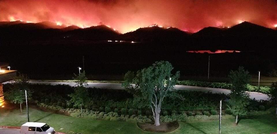 The flames from the Yolo County fire billowing over the hills as seen from the Cache Creek Casino. Photo by Reggie Guillory