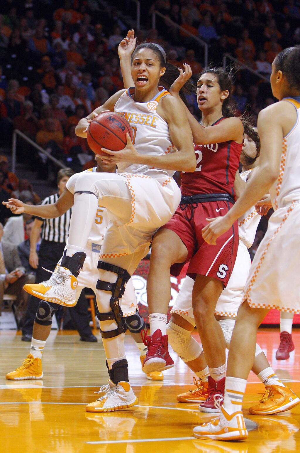 Tennessee center Isabelle Harrison (20) grabs a rebound away from Stanford forward Kailee Johnson (32) in the first half of an NCAA college basketball game, Saturday, Dec. 20, 2014, in Knoxville, Tenn. (AP Photo/Wade Payne)