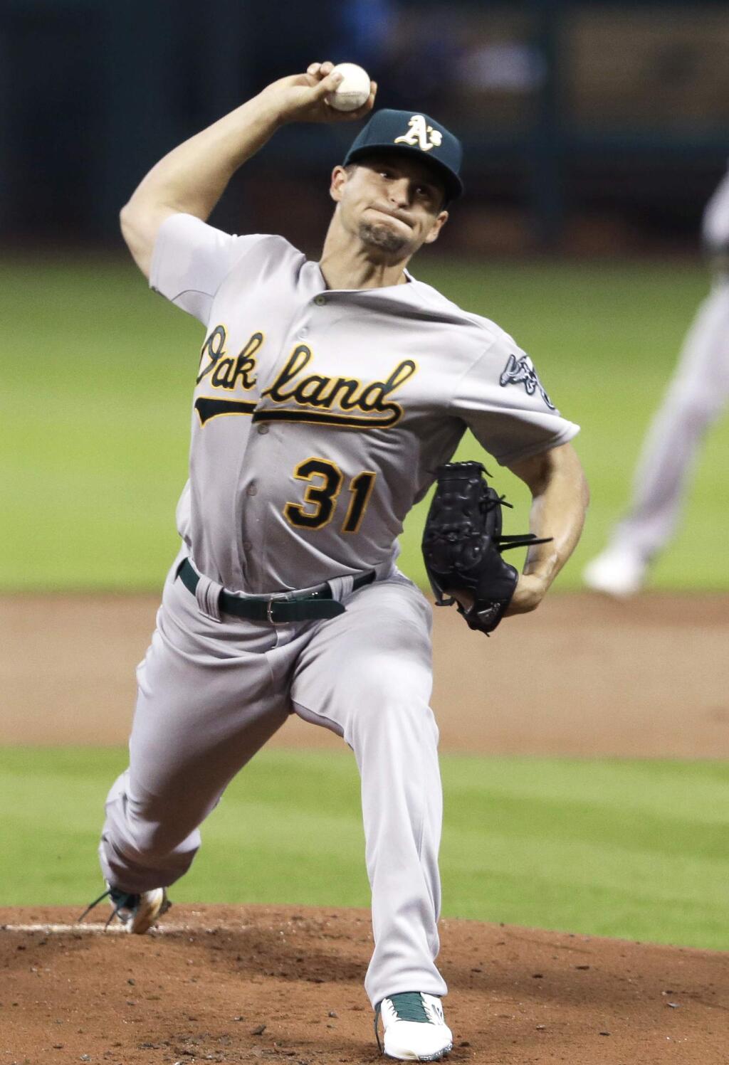 Oakland Athletics' Kendall Graveman delivers a pitch against the Houston Astros in the first inning of a game Tuesday, April 14, 2015, in Houston. (AP Photo/Pat Sullivan)