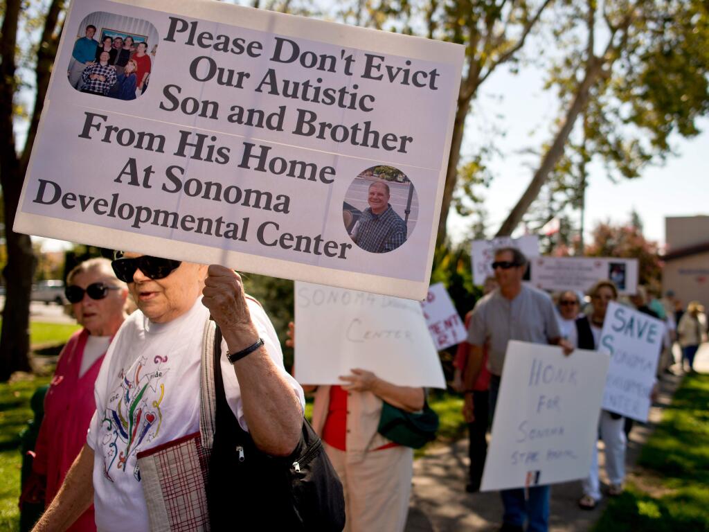 Parents annd guardians of Sonoma Developmental Center residents marching at a 2013 demonstration against state plans to close the fadcility. (ALVIN JORNADA / The Press Democrat)