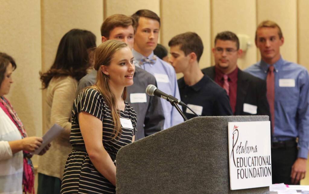 Riley Mauch of Saint Vincent de paul High School tells her name and what college she will be attending in the fall after receiving one of 16 Victor DeCarli Family Scholarships in front of the standing room crowd at the Petaluma Educational Foundation 2015 PEF Scholarship Reception at the Sheraton Petaluma on Wednesday, April 29, 2015. (SCOTT MANCHESTER/ARGUS-COURIER STAFF)