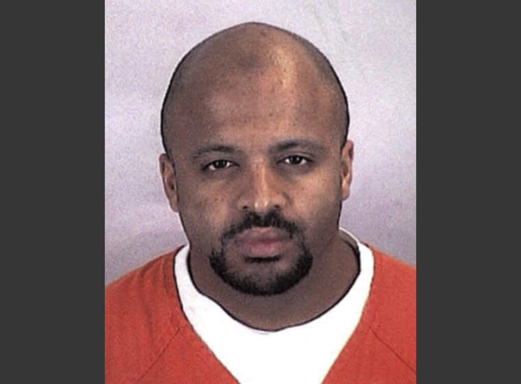 FILE - This undated file photo provided by the Sherburne County Sheriff Office shows Zacarias Moussaoui. Moussaou, the only man ever convicted in a U.S. court for a role in the Sept. 11 attacks now says he is renouncing terrorism, Al-Qaida and the Islamic State. In a handwritten court motion Moussaoui filed with the federal court in Alexandria last April 2020, Moussaoui wrote, “Ï denounce, repudiate Usama bin Laden as a useful idiot of the CIA/Saudi. I also proclaim unequivocally my opposition to any terrorist action, attack, propaganda against the U.S.” (Sherburne County, Minn., Sheriff's Office via AP, File)