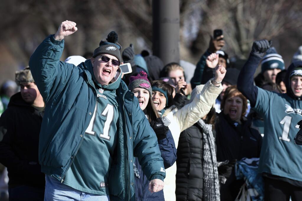 Philadelphia Eagles NFL football team fans celebrate during the Super Bowl LII victory parade, Thursday, Feb 8, 2018, in Philadelphia. (AP Photo/Michael Perez)