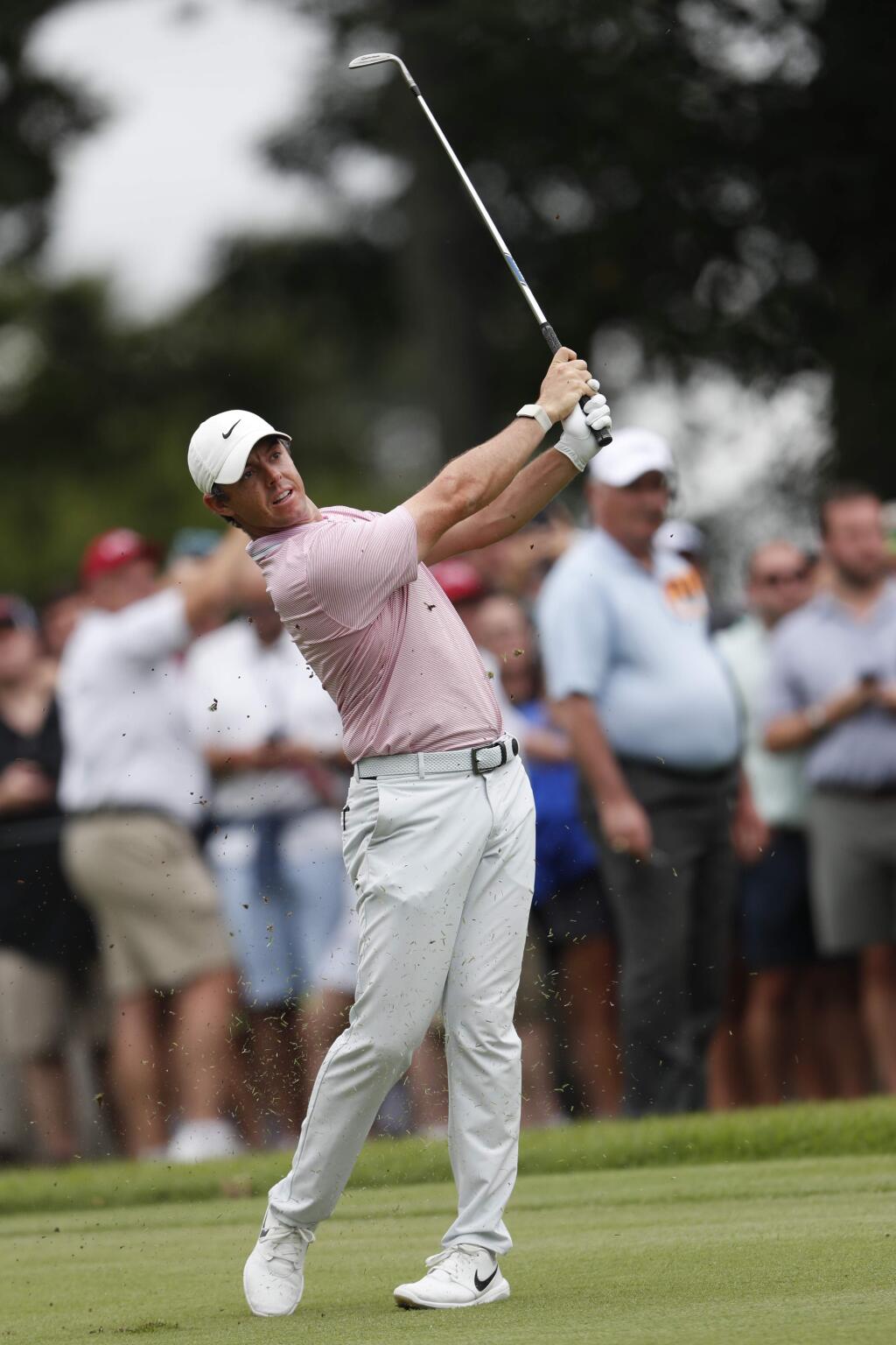 Rory McIlroy watches his shot on the fifth fairway during the final round of the Tour Championship golf tournament Sunday, Aug. 25, 2019, at East Lake Golf Club in Atlanta. (AP Photo/John Bazemore)