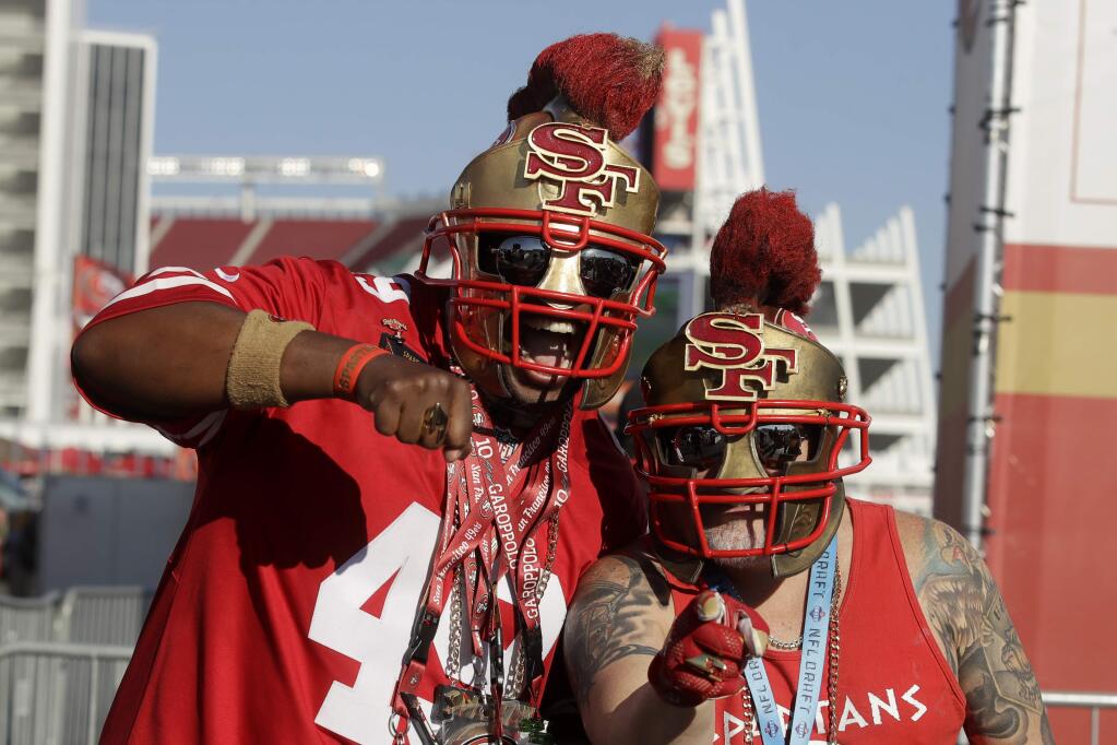 Fans tailagate at Levi's Stadium before a game between the San Francisco 49ers and the Green Bay Packers in Santa Clara, Sunday, Nov. 24, 2019. (AP Photo/Ben Margot)