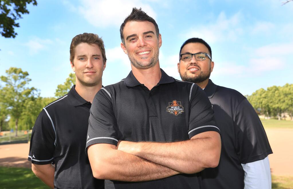 Former Giants pitcher Noah Lowry, center, teamed up with Junior Giants ambassador Elliott North, left, and recreation and parks specialist Juan Flores, right, to start a branch of the program in Santa Rosa in 2015. (KENT PORTER / PD)