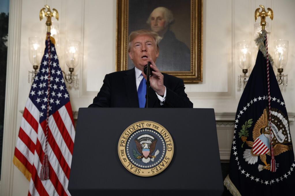 President Donald Trump speaks about Iran from the Diplomatic Reception Room at the White House in Washington, Friday, Oct. 13, 2017. Trump says Iran is not living up to the 'spirit' of the nuclear deal that it signed in 2015, and announced a new strategy in the speech. He says the administration will impose additional sanctions on the regime to block its financing of terrorism. (AP Photo/Evan Vucci)