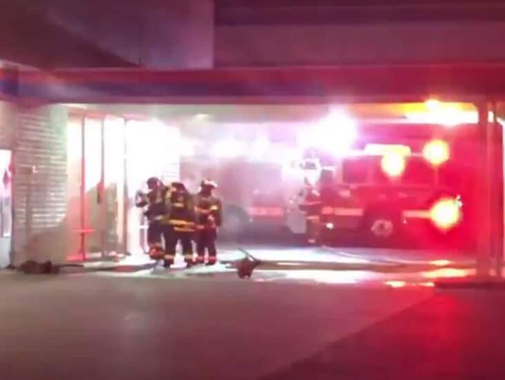 In a screenshot from video, firefighters respond to a blaze at a Firestone Complete Auto Care shop in Santa Rosa on Sunday, April 12, 2020. (Santa Rosa Fire Department)