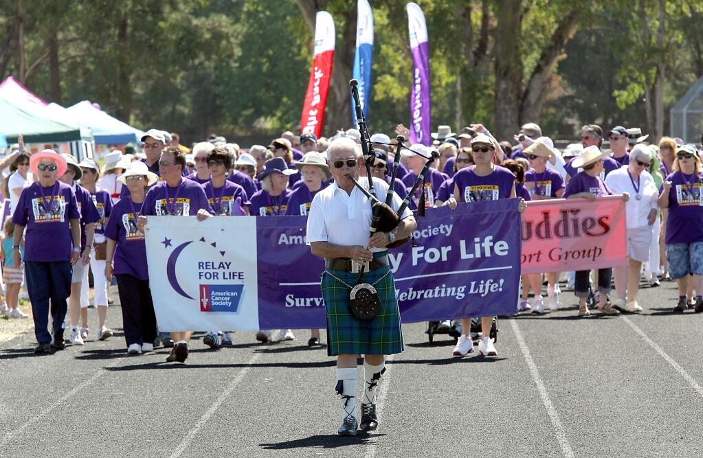 Cancer survivors walk the survivors lap to start the American Cancer Society's Relay for Life at Sonoma Valey High School in Sonoma on Saturday August 2, 2008. Scott Manchester / The Press Democrat