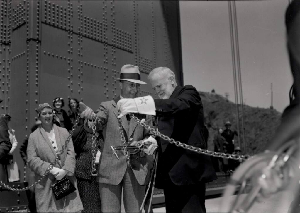 10/26/2003: B1: Frank Doyle, right, president of Santa Rosa's Exchange Bank and leader of efforts to build the Golden Gate Bridge, cuts the chain and opens the bridge to automobiles with other dignitaries.