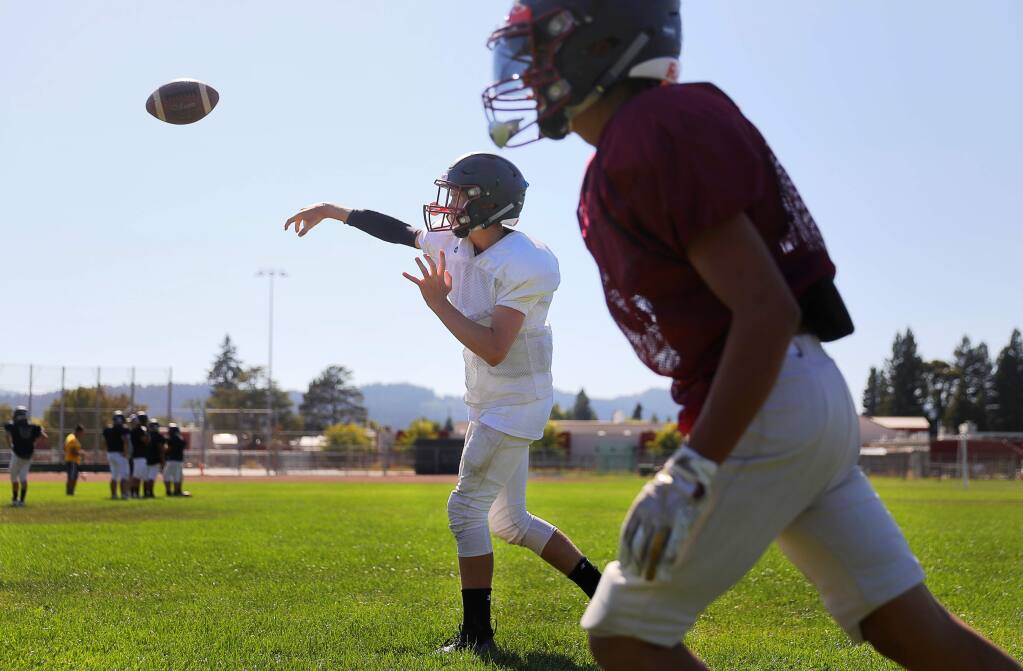 Healdsburg quarterback Cole Conley throws a pass during practice in Healdsburg on Wednesday, August 14, 2019. (Christopher Chung / The Press Democrat)