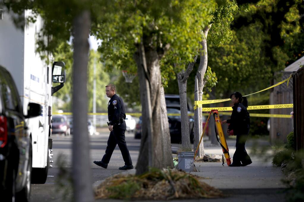 Santa Rosa police secure the scene of a homicide at 2839 Red Tail Street in Santa Rosa, on Monday, May 11, 2015. (BETH SCHLANKER/ The Press Democrat)