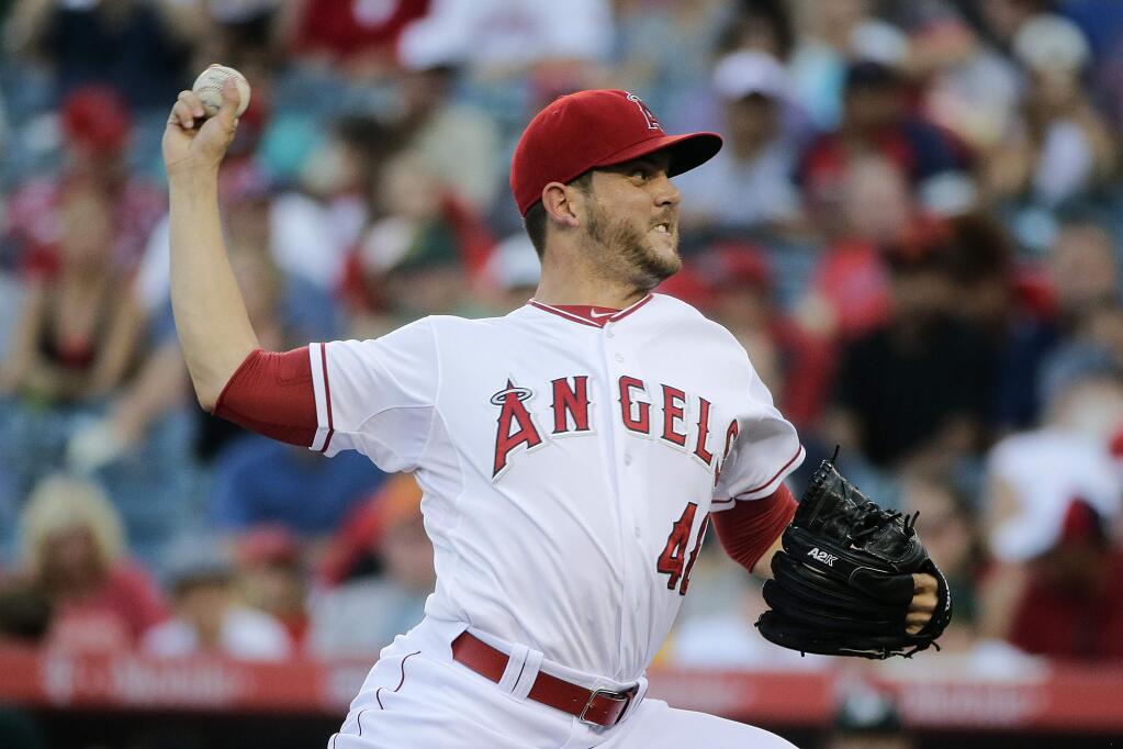Los Angeles Angels starting pitcher Cory Rasmus throws against the Oakland Athletics during the first inning of a baseball game Saturday, Aug. 30, 2014, in Anaheim, Calif. (AP Photo/Jae C. Hong)