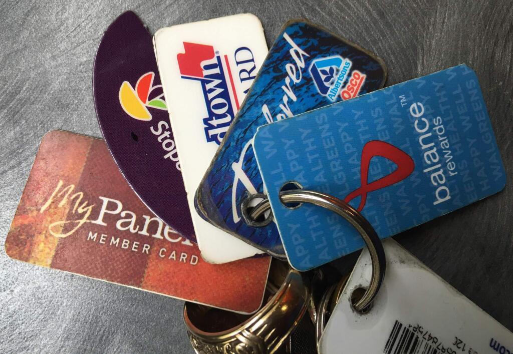 This Wednesday, Aug. 31, 2016 photo shows rewards cards on a keychain in New York. From department stores to drugstores, retailers are asking consumers to enroll in rewards programs, also called loyalty programs, for access to better deals. But signing up may not be worth the hassle. (AP Photo/Swayne B. Hall)
