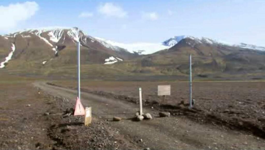 In an in an image from an Aug. 19, 2014 video, a sign is posted on the road next to Bardarbunga, a subglacial stratovolcano located under Iceland's largest glacier. On Saturday, Aug. 23, 2014, Iceland closed airspace over the Bardarbunga volcano on Saturday after the Meteorological Office said an eruption had begun under the ice of Europeís largest glacier. The English portion of the sign reads, ''Uncertainty phase due to unrest in Bardarbunga'. (AP Photo/Courtesy Channel 2 Iceland)