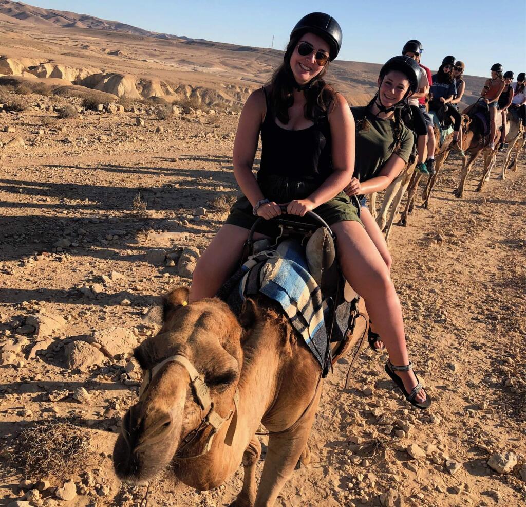 Lily Shapiro, SVHS '14, rising a camel on her 'Birthright Israel' trip last summer.