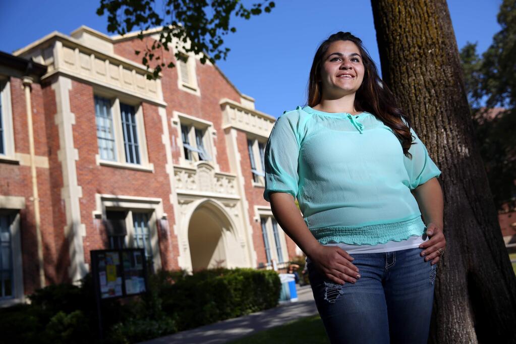 Juanita Tlahuitzo is graduating from Santa Rosa Junior College with honors, majoring in social and behavioral sciences. Tlahuitzo, who grew up in Roseland, is a former gang member, and a mother of two young children.(Christopher Chung/ The Press Democrat)