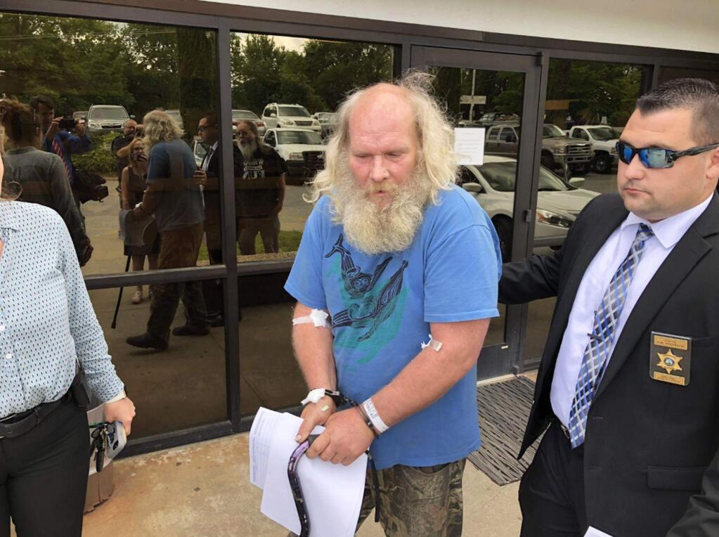 This photo taken from video provided by WSOC-TV shows suspect Edwin Hiatt after his arrest Thursday, May 9, 2019, in Burke County, N.C. Hiatt is charged with bludgeoning and strangling to death a Hollywood TV director more than three decades ago. Authorities say the FBI arrested Hiatt after DNA evidence linked him to the 1985 death of Barry Crane in Los Angeles. (WSOC-TV via AP)