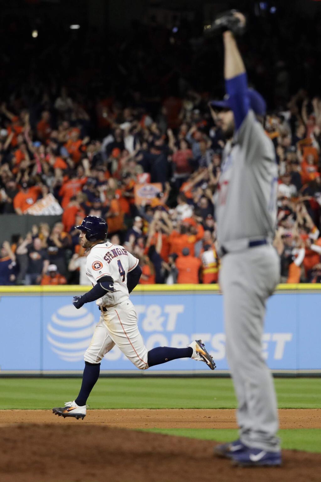 Houston Astros' George Springer hits a home run off Los Angeles Dodgers relief pitcher Brandon Morrow during the seventh inning of Game 5 of baseball's World Series Sunday, Oct. 29, 2017, in Houston. (AP Photo/Matt Slocum)
