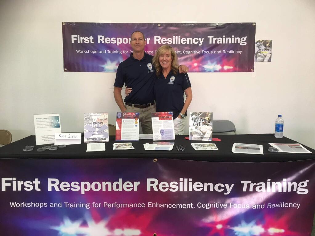 Ron Shull and Susan Farren at their First Responder Resiliency booth at the Sonoma County Fair. (COURTESY PHOTO)