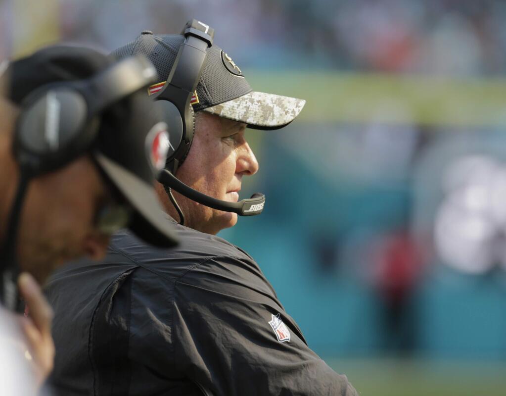 San Francisco 49ers head coach Chip Kelly looks at his team during the first half of a game against the Miami Dolphins, Sunday, Nov. 27, 2016, in Miami Gardens, Fla. (AP Photo/Lynne Sladky)