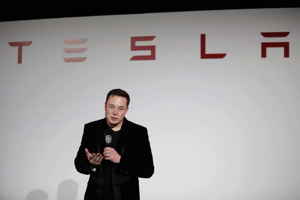 FILE - In a Sept. 29, 2015, file photo, Elon Musk, CEO of Tesla Motors Inc., talks about the Model X car at the company's headquarters, in Fremont, Calif. (AP Photo/Marcio Jose Sanchez, File)