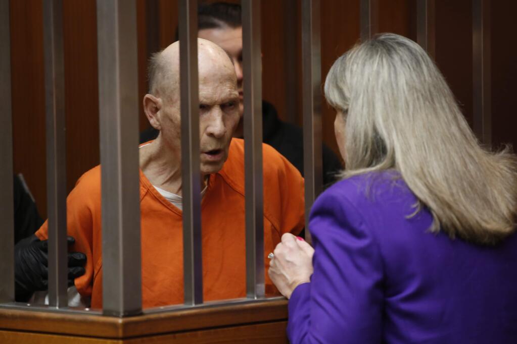 Joseph James DeAngelo, charged with being the Golden State Killer, talks with his attorney, Diane Howard, during his appearance in Sacramento County Superior Court in Sacramento, Calif., Thursday, March 12, 2020. Superior Court Judge Steve White approved prosecutors' request to take more DNA samples from DeAngelo over the objections of his defense attorneys. (AP Photo/Rich Pedroncelli)
