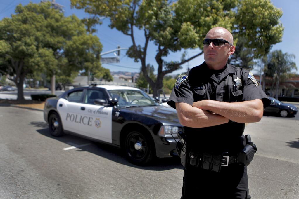 Petaluma, CA, USA.Thursday, July 28, 2016. Petaluma Police Officer Rob Hawkins patrols the city, responding to calls, complaints and traffic violators. (CRISSY PASCUAL/ARGUS-COURIER STAFF)