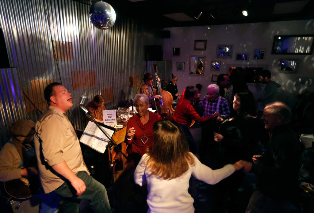 Robert 'Sonoma Satchmo' O'Maoilriain, left, sings Louisiana dance music including some Zydeco favorites at Sonoma Speakeasy and American Music Hall in 2015. (Alvin Jornada / The Press Democrat)