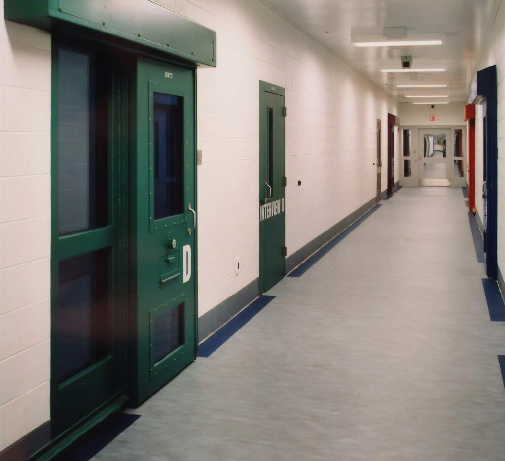 This image provided by the Shenandoah Valley Juvenile Center shows part of the interior of the building in Staunton, Va. Immigrant children as young as 14 housed at the juvenile detention center say they were beaten while handcuffed and locked up for long periods in solitary confinement, left nude and shivering in concrete cells. The abuse claims are detailed in federal court filings that include a half-dozen sworn statements from Latino teens jailed there for months or years. (Shenandoah Valley Juvenile Center via AP)