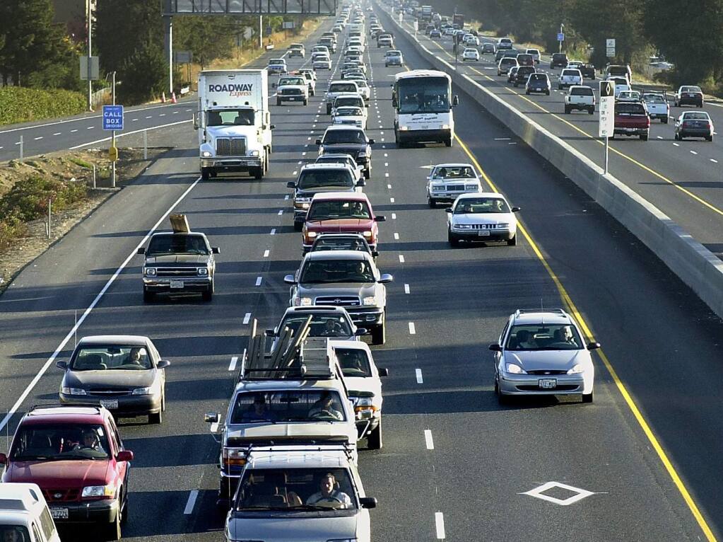 Commuter traffic on northbound Highway 101 looking south from the Hearn Avenue overpass. Transportation accounts for the largest human-caused source of carbon emissions in Sonoma County and most of the North Bay. (Press Democrat File)