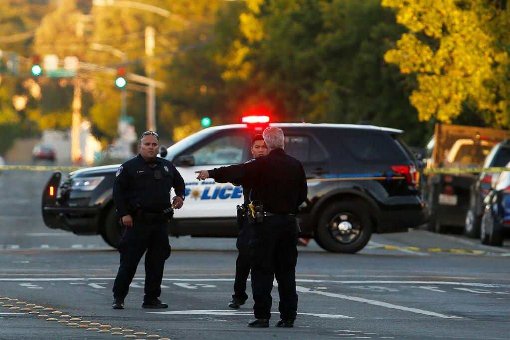 Santa Rosa police officers investigate the scene of a shooting that occurred on West 9th Street, near Jacobs Park, in Santa Rosa, California, on Wednesday, June 5, 2019. (ALVIN JORNADA/ PD)
