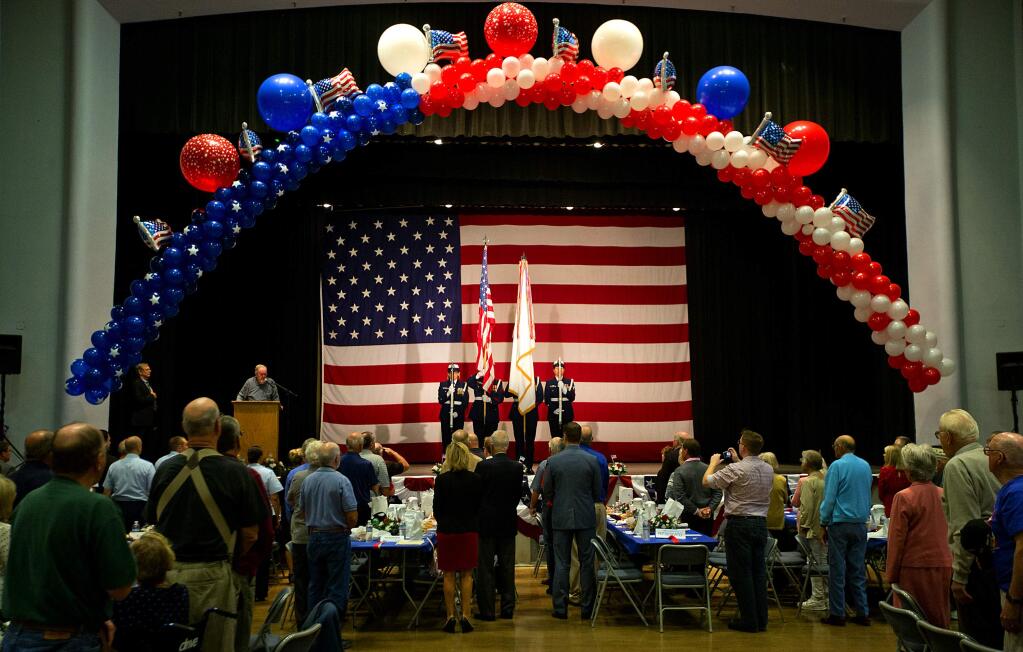 The color guard present the flag at the 16th annual Tribute to Our Veterans luncheon at the Santa Rosa Veterans Memorial hall on Wednesday. (John Burgess/The Press Democrat)