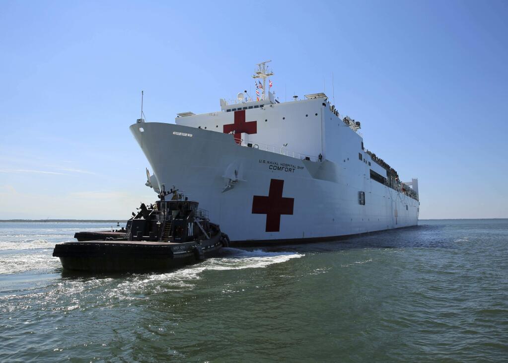 The Military Sealift Command hospital ship USNS Comfort (T-AH 20) departs Naval Station Norfolk to support hurricane relief efforts in Puerto Rico, Friday, Sept. 29, 2017 in Norfolk, Va.. The Department of Defense is supporting the Federal Emergency Management Agency, the lead federal agency, in helping those affected by Hurricane Maria to minimize suffering and is one component of the overall whole-of-government response effort. (Bill Mesta/U.S. Navy via AP)