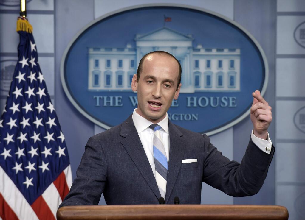 FILE - In this Aug. 2, 2017 file photo, White House senior policy adviser Stephen Miller speaks during the daily briefing at the White House in Washington. A California school district has suspended a teacher who recounted how Miller ate glue as a third-grader. Nikki Fiske told the Hollywood Reporter that when Miller was a student in her Santa Monica, Calif., classroom, he was a loner with a messy desk who played with glue. The Los Angeles Times says the Santa Monica-Malibu Unified School District placed Fiske on 'home assignment' while it decides what to do, if anything, about the disclosures. (AP Photo/Susan Walsh, File)