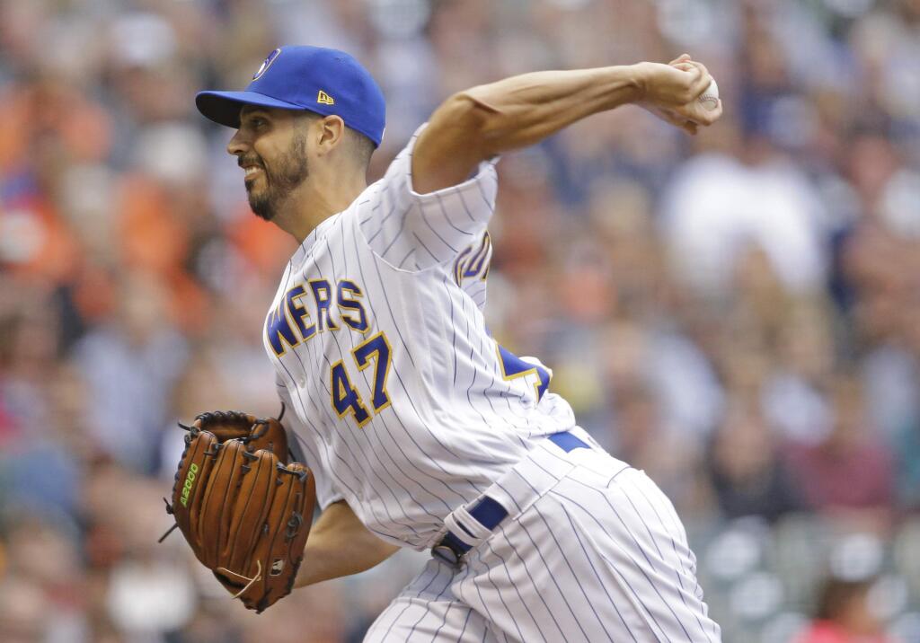 Milwaukee Brewers starting pitcher Gio Gonzalez throws to the San Francisco Giants during the first inning of a baseball game, Saturday, Sept. 8, 2018, in Milwaukee. (AP Photo/Jeffrey Phelps)