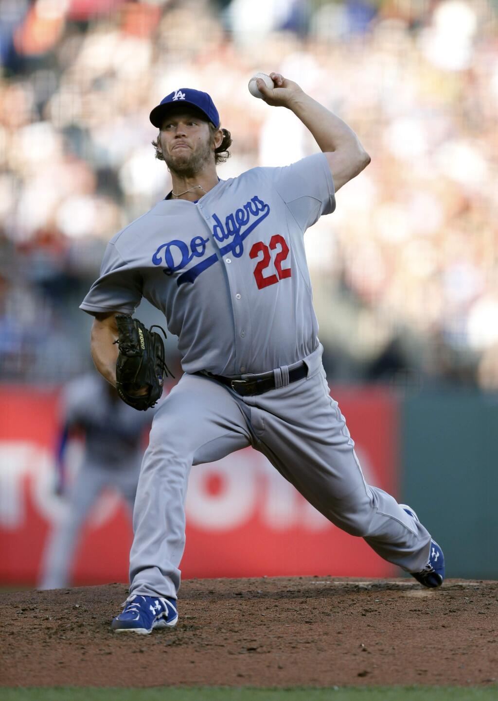 Los Angeles Dodgers starting pitcher Clayton Kershaw winds up during the third inning of a baseball game against the San Francisco Giants, Saturday, July 26, 2014, in San Francisco. (AP Photo/Beck Diefenbach)