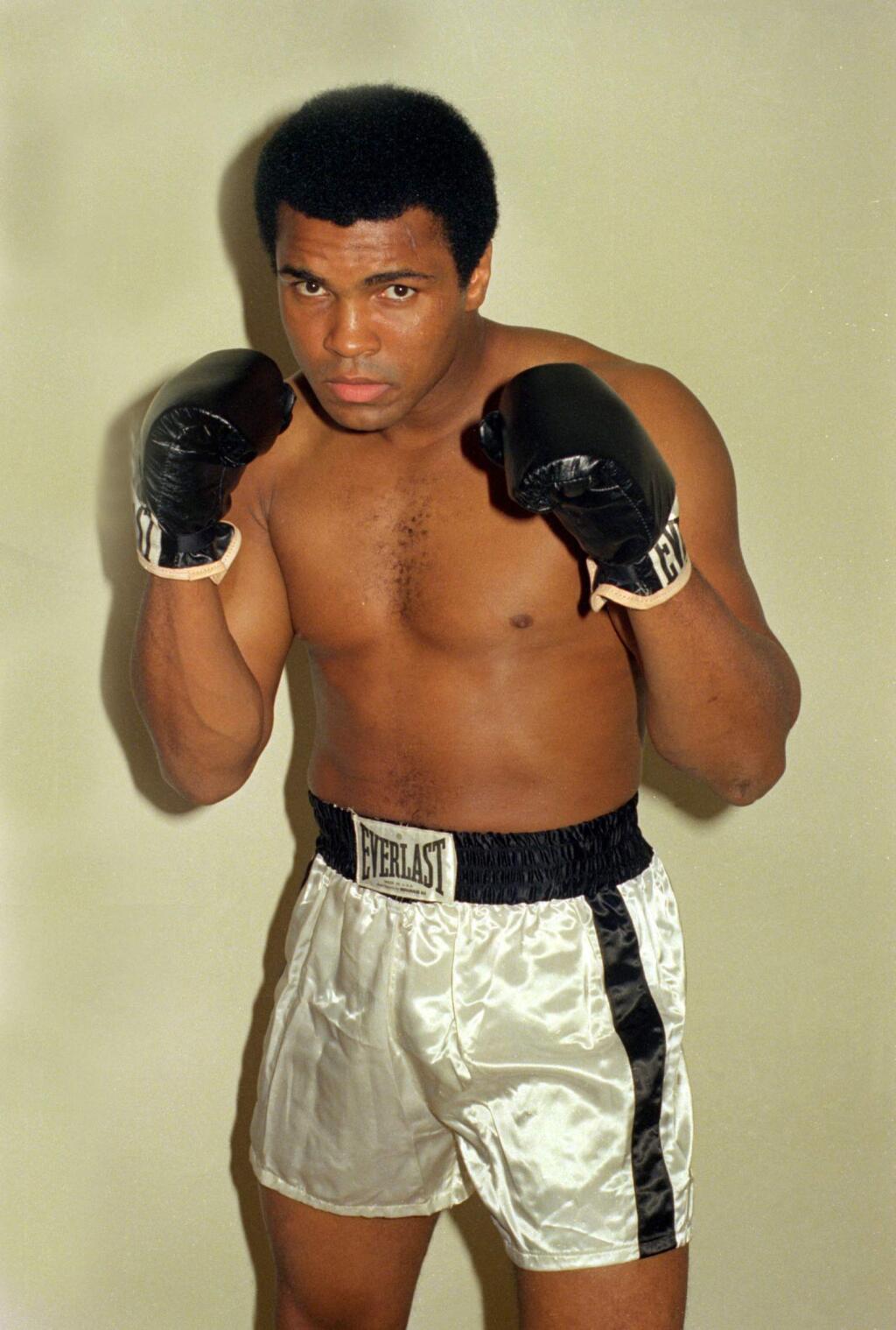 FILE - This is an Oct. 9, 1974, file photo showing Muhammad Ali. Ali, the magnificent heavyweight champion whose fast fists and irrepressible personality transcended sports and captivated the world, has died according to a statement released by his family Friday, June 3, 2016. He was 74. (AP Photo/Ross D. Franklin, File)(AP Photo/FIle)