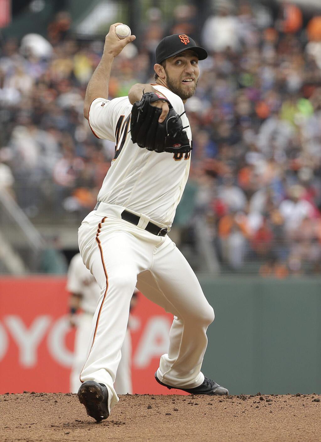 San Francisco Giants pitcher Madison Bumgarner throws against the Los Angeles Dodgers during the first inning of a baseball game in San Francisco, Saturday, April 9, 2016. (AP Photo/Jeff Chiu)