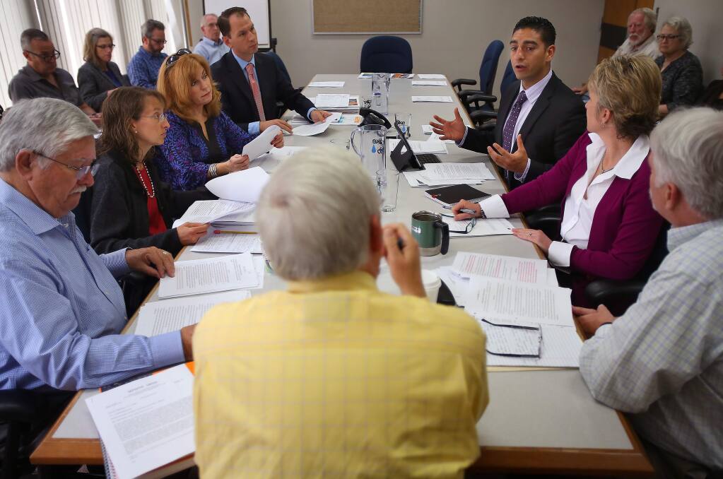 Sonoma County Supervisor Efren Carrillo, third from right, talks during a Roseland Annexation Subcommittee meeting at Santa Rosa City Hall on Thursday, May 8, 2014. Sonoma County Supervisor Shirlee Zane, third from left, offered harsh comments concerning Carrillo's behavior and called for his resignation at last Tuesday's board of supervisors meeting.(Christopher Chung/ The Press Democrat)